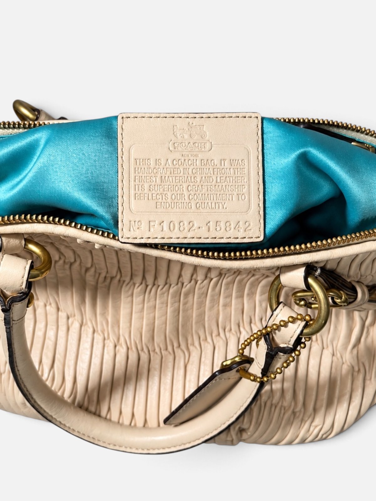 Coach satchel vintage en cuir plisse beige